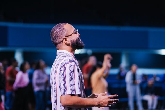 Members worshipping together in church